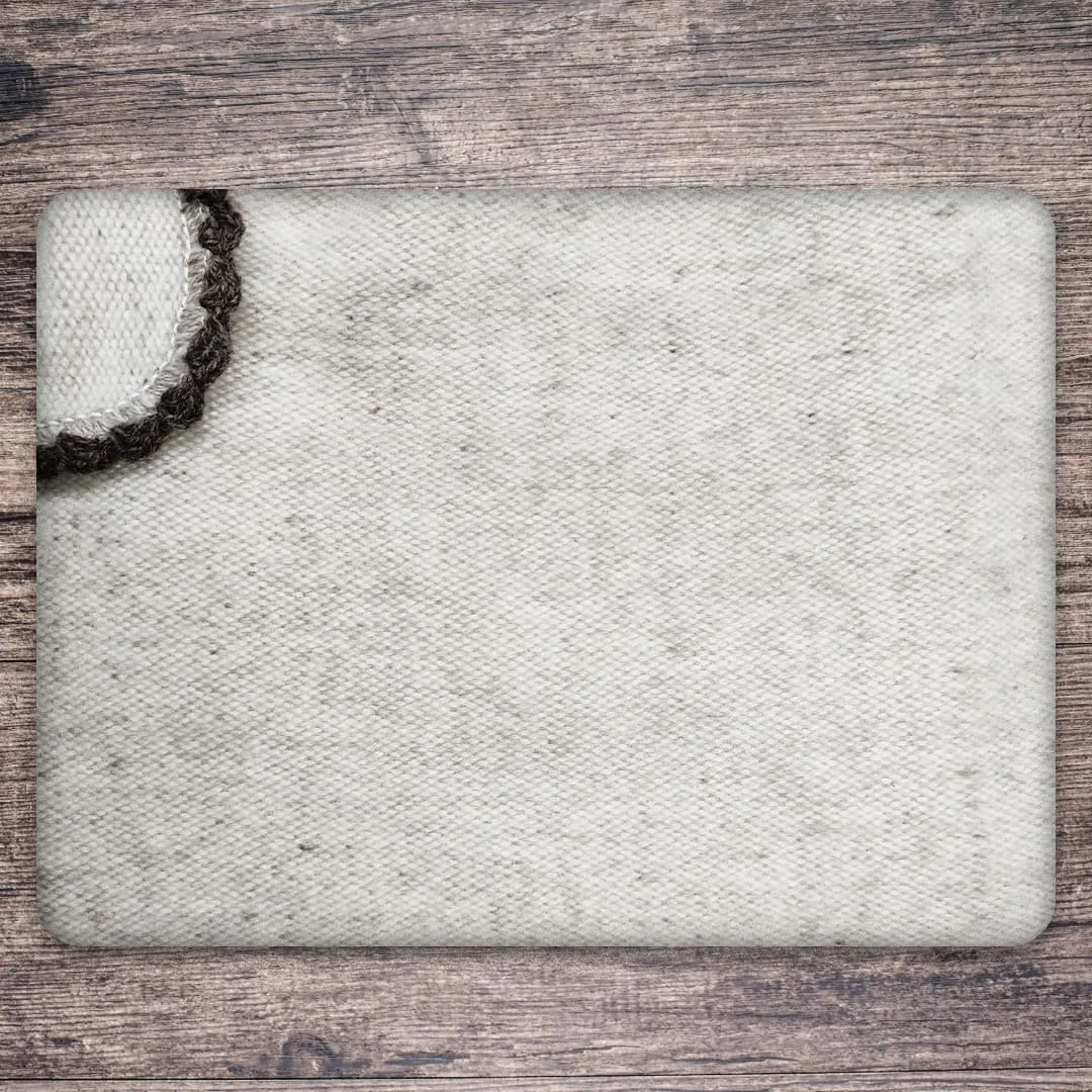 Capa bordada cuello sport · Detalle del tejido